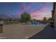 Expansive brick-paved backyard featuring a luxurious pool, spa, and an outdoor seating area at 3414 E Virgil Dr, Gilbert, AZ 85298