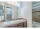 This bathroom has double sinks, granite countertops and a shower at 3414 E Virgil Dr, Gilbert, AZ 85298