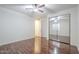 Well-lit bedroom with a mirrored closet and gorgeous wood floors at 3414 E Virgil Dr, Gilbert, AZ 85298