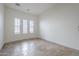 Bright bedroom features plantation shutters and tile flooring at 3414 E Virgil Dr, Gilbert, AZ 85298