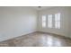 Bright bedroom features plantation shutters and tile flooring at 3414 E Virgil Dr, Gilbert, AZ 85298