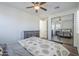 Bright bedroom with mirrored closet doors and wood floors at 3414 E Virgil Dr, Gilbert, AZ 85298