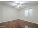 Bright bedroom features beautiful wood floors and a ceiling fan at 3414 E Virgil Dr, Gilbert, AZ 85298
