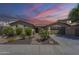 Charming single-story home with desert landscaping, brick walkway, and attached two-car garage at 3414 E Virgil Dr, Gilbert, AZ 85298