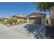 Single-story home with desert landscaping and an attached two-car garage at 3414 E Virgil Dr, Gilbert, AZ 85298