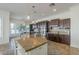 Spacious kitchen boasts a granite island and adjacent dining area at 3414 E Virgil Dr, Gilbert, AZ 85298