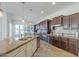 Spacious kitchen with a large island, white cabinetry, stainless appliances, and dark wood accents, perfect for entertaining at 3414 E Virgil Dr, Gilbert, AZ 85298
