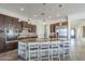 Gourmet kitchen island featuring stainless steel appliances and seating at 3414 E Virgil Dr, Gilbert, AZ 85298