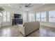Open living room featuring plantation shutters and dark wood accents at 3414 E Virgil Dr, Gilbert, AZ 85298