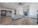 Open living room showcases a fireplace, tile flooring, and kitchen access at 3414 E Virgil Dr, Gilbert, AZ 85298