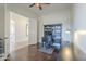 Bright home office featuring a dark wood desk and a view through the open doorway at 3414 E Virgil Dr, Gilbert, AZ 85298