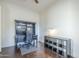 Spacious office featuring a built-in desk with shelving and dark wood floors at 3414 E Virgil Dr, Gilbert, AZ 85298
