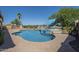 Private backyard oasis boasts a sparkling pool, comfortable lounge chairs, and lush landscaping at 3414 E Virgil Dr, Gilbert, AZ 85298