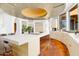 Bright kitchen features a large island, wooden cabinetry, and ample counter space at 5802 E Cholla Ln, Paradise Valley, AZ 85253