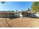 Large backyard with covered patio and detached garage at 1719 E Verde Ln, Phoenix, AZ 85016