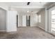 Well-lit bedroom with carpet, closet, and access to a bathroom at 1719 E Verde Ln, Phoenix, AZ 85016