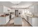 Modern kitchen with white cabinets, granite counters, and stainless steel appliances at 1719 E Verde Ln, Phoenix, AZ 85016