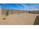 Large, graveled backyard enclosed by a block wall, providing a private outdoor space at 18246 W Cielo Grande Ave, Surprise, AZ 85387