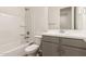 A bathroom features a tub and shower combo and a vanity with under-sink storage at 18246 W Cielo Grande Ave, Surprise, AZ 85387