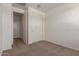 A comfortable bedroom with neutral carpet and a closet at 18246 W Cielo Grande Ave, Surprise, AZ 85387
