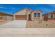 Charming single-story home with stucco siding, desert landscaping, and a two-car garage on a sunny day at 18246 W Cielo Grande Ave, Surprise, AZ 85387
