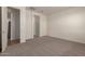 Large main bedroom with plush carpeting and open entry to the main bathroom at 18246 W Cielo Grande Ave, Surprise, AZ 85387