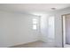 Bright bedroom featuring a window for natural light and an attached closet at 2445 W Rowel Rd, Phoenix, AZ 85085