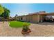 Artificial turf lawn, covered patio, and storage shed in backyard at 6908 W Sunnyside Dr, Peoria, AZ 85345