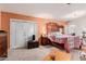 Cozy bedroom featuring a decorative wooden bed frame and private access to the backyard at 6908 W Sunnyside Dr, Peoria, AZ 85345