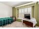 Bright bedroom with built-in shelves, shutters, and neutral carpeting at 6908 W Sunnyside Dr, Peoria, AZ 85345