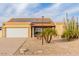 Desert landscape surrounds this single-story home with solar panels and a two-car garage at 6908 W Sunnyside Dr, Peoria, AZ 85345