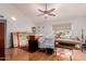 Bright living room with vaulted ceilings, hardwood floors, and a large bay window overlooking the front yard at 6908 W Sunnyside Dr, Peoria, AZ 85345