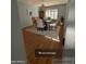 Formal dining room features a modern chandelier and bright, shuttered windows at 10423 W Wheatridge Dr, Sun City, AZ 85373