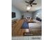 Spacious living room featuring a sectional sofa and skylights at 10423 W Wheatridge Dr, Sun City, AZ 85373