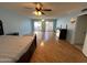 Spacious main bedroom with hardwood floors and sliding glass doors at 10423 W Wheatridge Dr, Sun City, AZ 85373