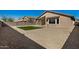 Backyard with gravel, artificial turf, and block wall at 5411 W Grenadine Rd, Laveen, AZ 85339