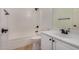 Clean bathroom with a shower/tub combo and white vanity at 5411 W Grenadine Rd, Laveen, AZ 85339