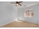 Bright bedroom with window and ceiling fan at 5411 W Grenadine Rd, Laveen, AZ 85339