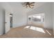 Well-lit bedroom featuring a large window and bathroom access at 5411 W Grenadine Rd, Laveen, AZ 85339