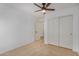 Simple bedroom with double door closet and ceiling fan at 5411 W Grenadine Rd, Laveen, AZ 85339