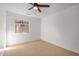 Cozy bedroom with ceiling fan and window at 5411 W Grenadine Rd, Laveen, AZ 85339