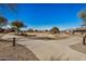 Curving concrete pathway with desert landscaping and community homes visible at 5411 W Grenadine Rd, Laveen, AZ 85339