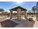 Stone-pillar covered picnic area with tables and benches at 5411 W Grenadine Rd, Laveen, AZ 85339