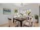 Dining room features a wood table and six beige chairs at 5411 W Grenadine Rd, Laveen, AZ 85339