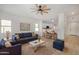 Living room features a comfy blue sofa and a coffee table at 5411 W Grenadine Rd, Laveen, AZ 85339