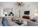 Living room with contemporary furnishings and a large TV at 5411 W Grenadine Rd, Laveen, AZ 85339