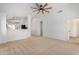 Spacious living room with neutral walls and carpeting at 5411 W Grenadine Rd, Laveen, AZ 85339