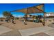 Sand-based playground with covered area and various play equipment at 5411 W Grenadine Rd, Laveen, AZ 85339