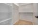 Spacious walk-in closet with shelving and hanging rods at 5411 W Grenadine Rd, Laveen, AZ 85339