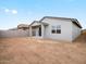 View of the backyard featuring the covered patio, block fence, and ample space at 3175 E Hayden Rose Ave, San Tan Valley, AZ 85143